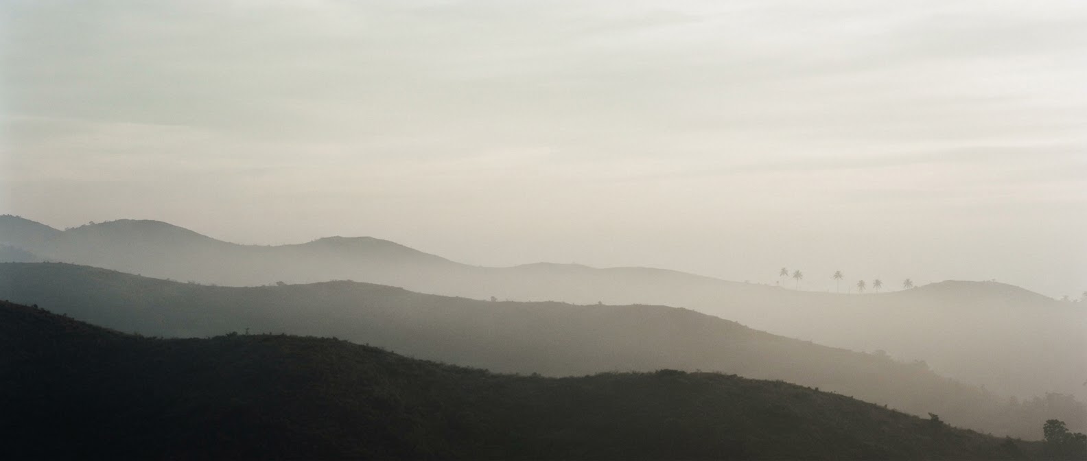 Layered misty hills at dawn